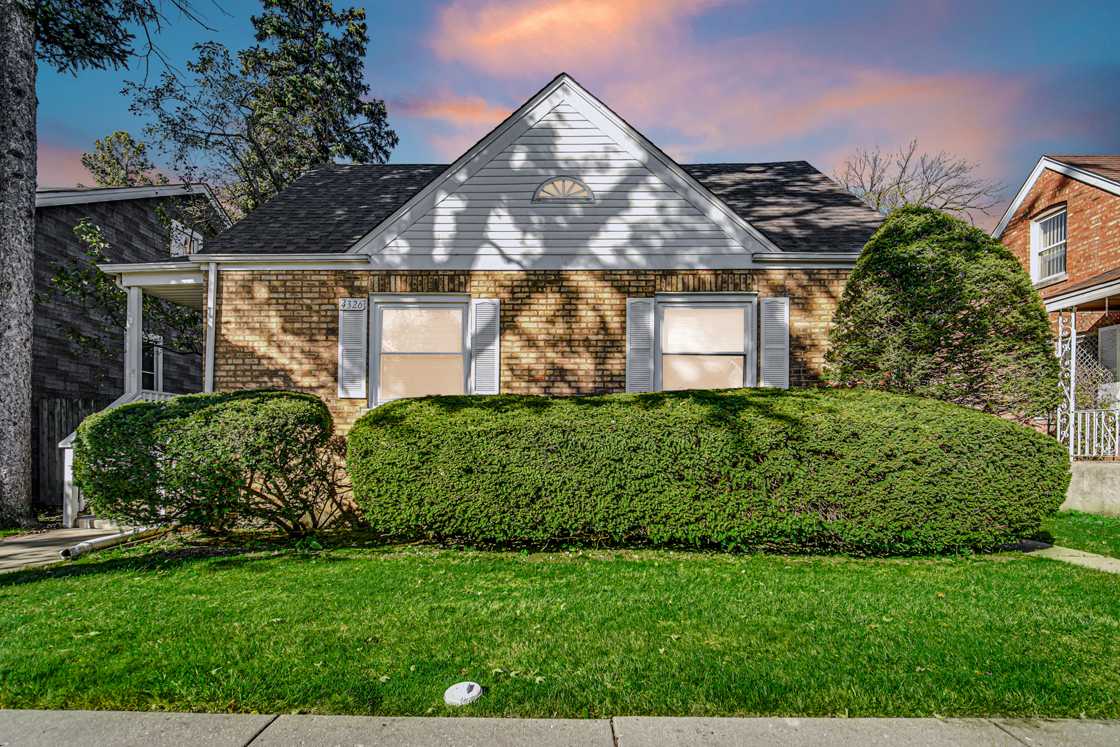 front view of a house with a yard