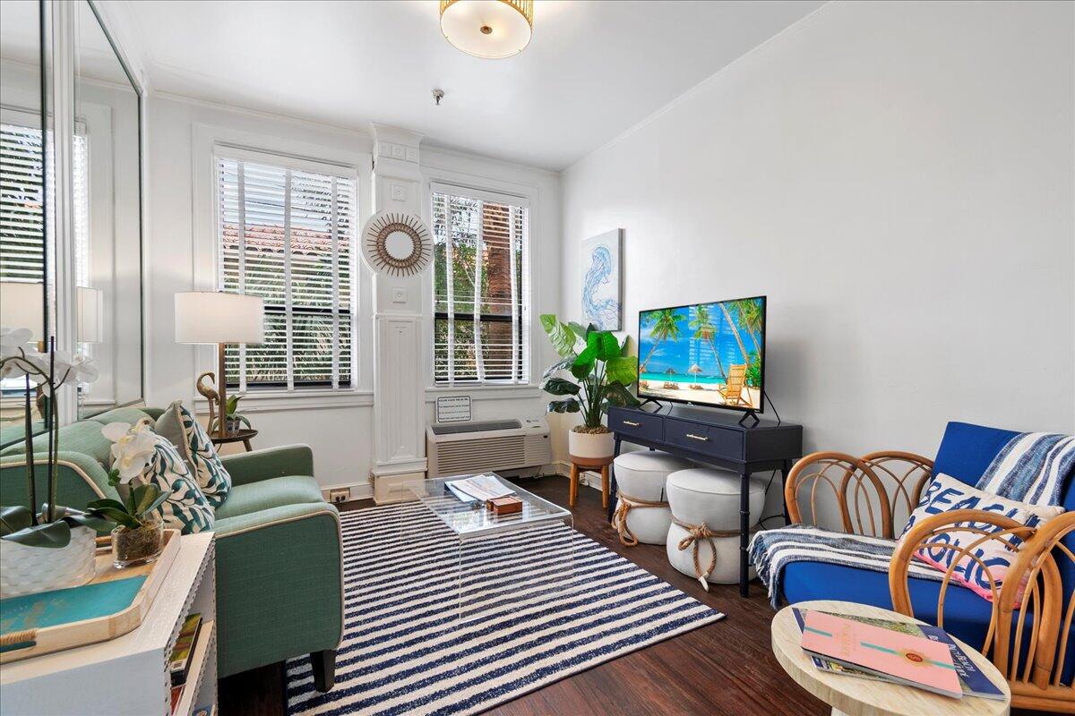 a living room with furniture and a flat screen tv