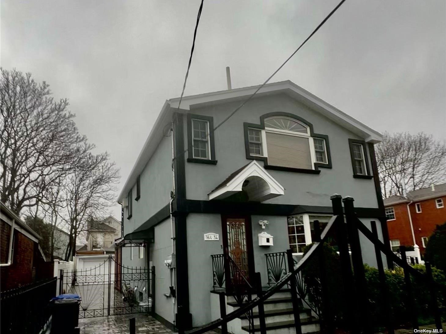 a front view of a house with parking space