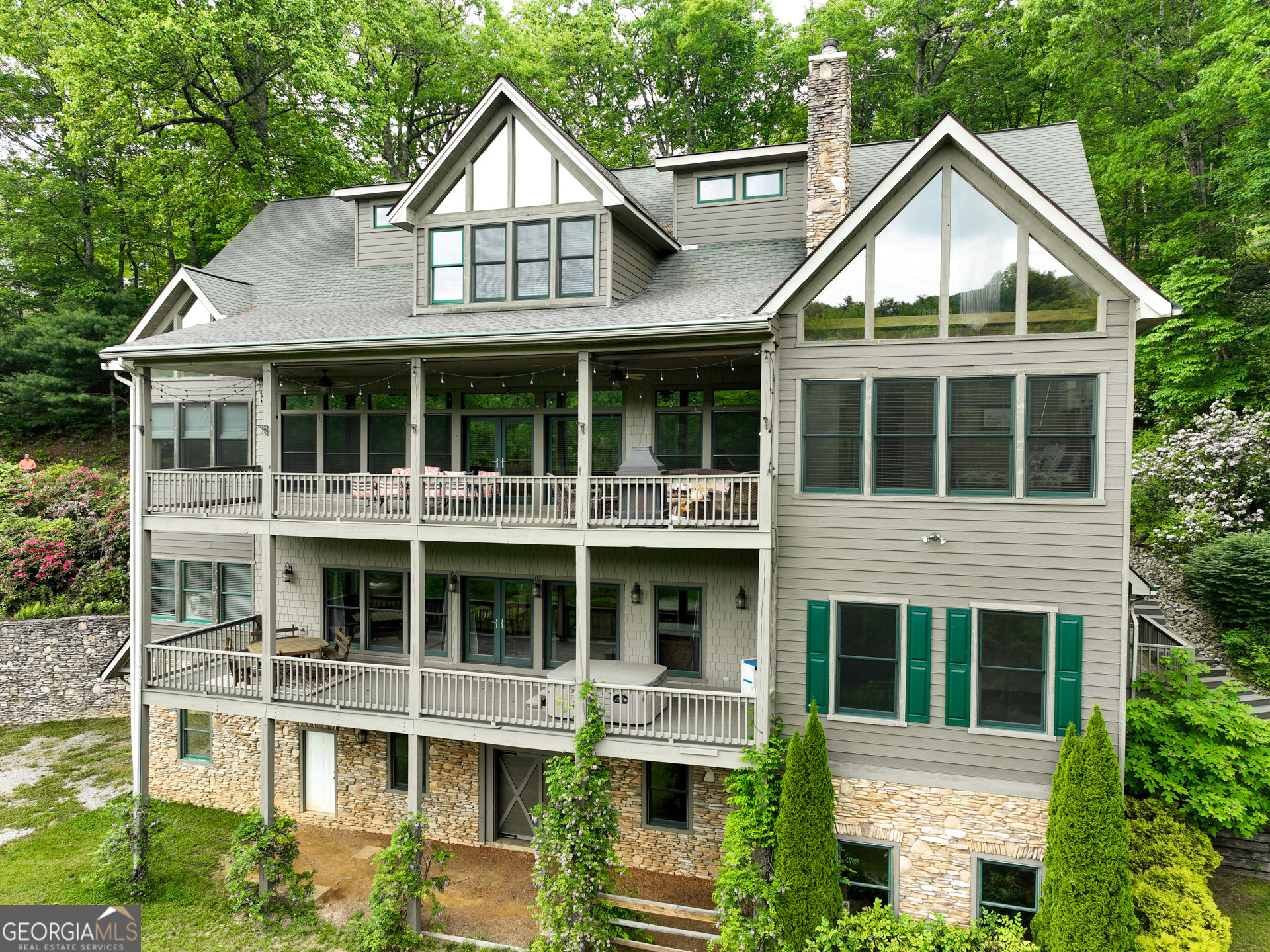 a front view of a house with a yard and porch