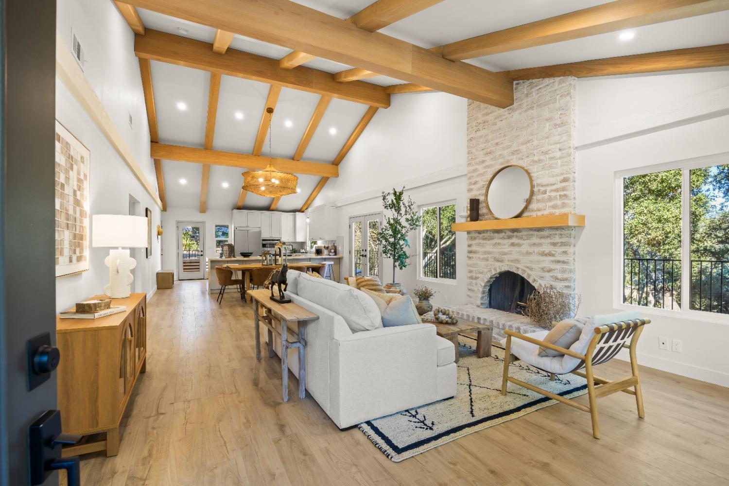 a living room with fireplace furniture and a fireplace