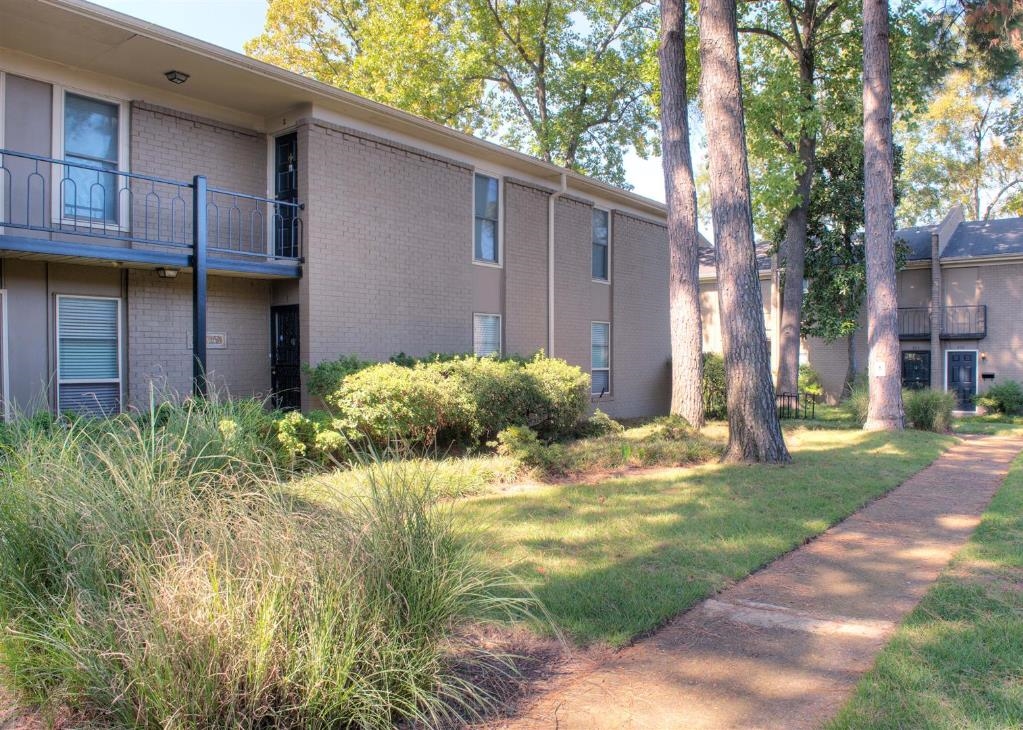 View of home's exterior featuring sidewalk