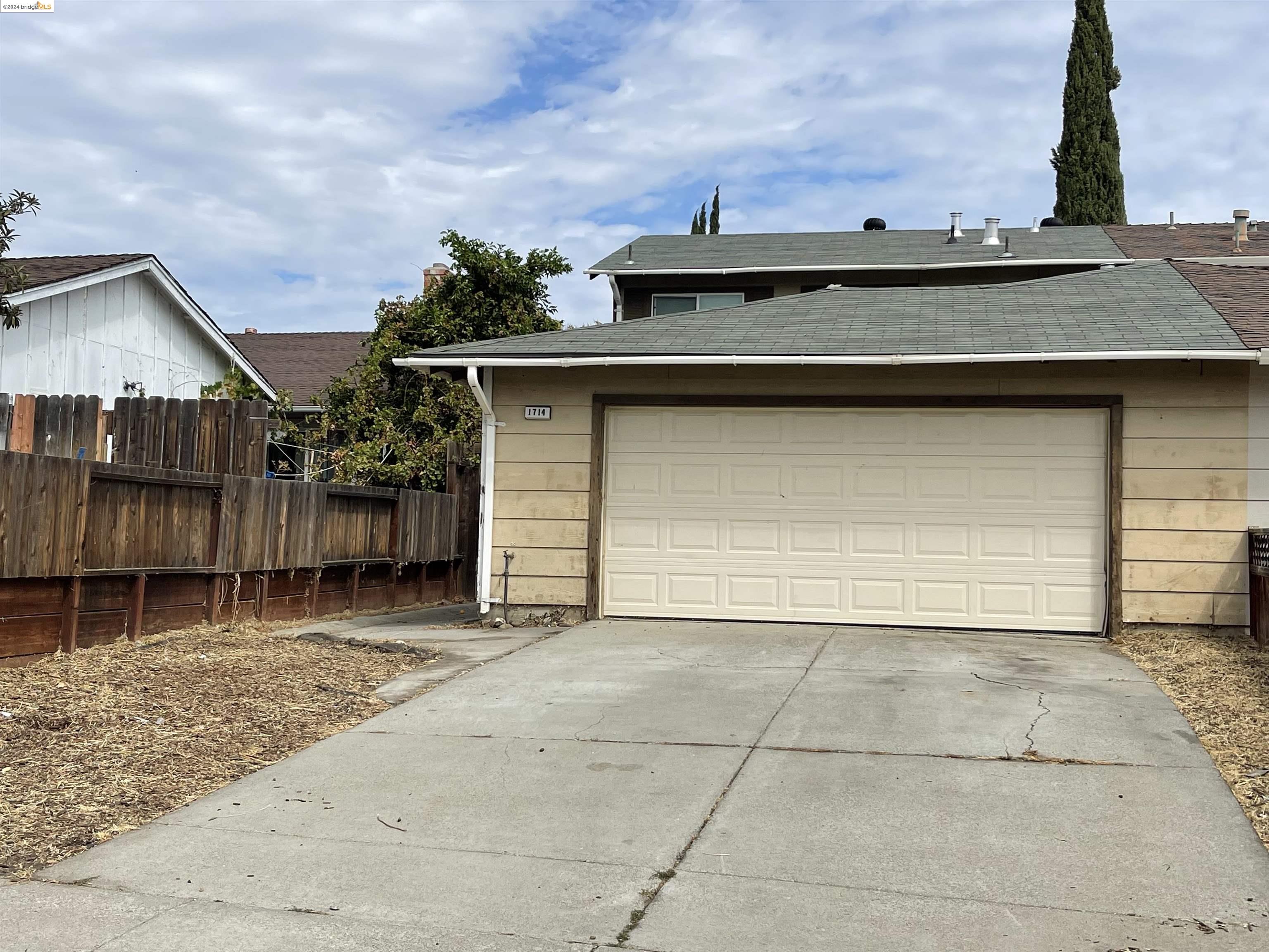 a front view of a house with garage