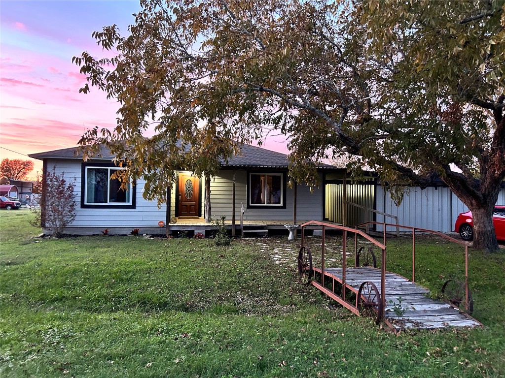 front view of a house with a yard