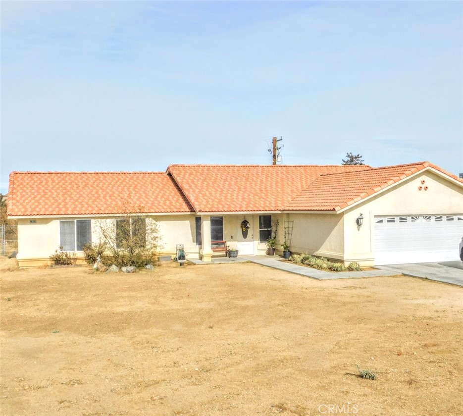 a view of a house next to a yard