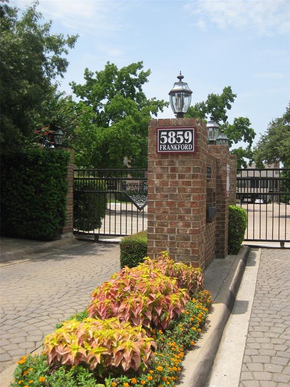 a street view with wooden fence and trees