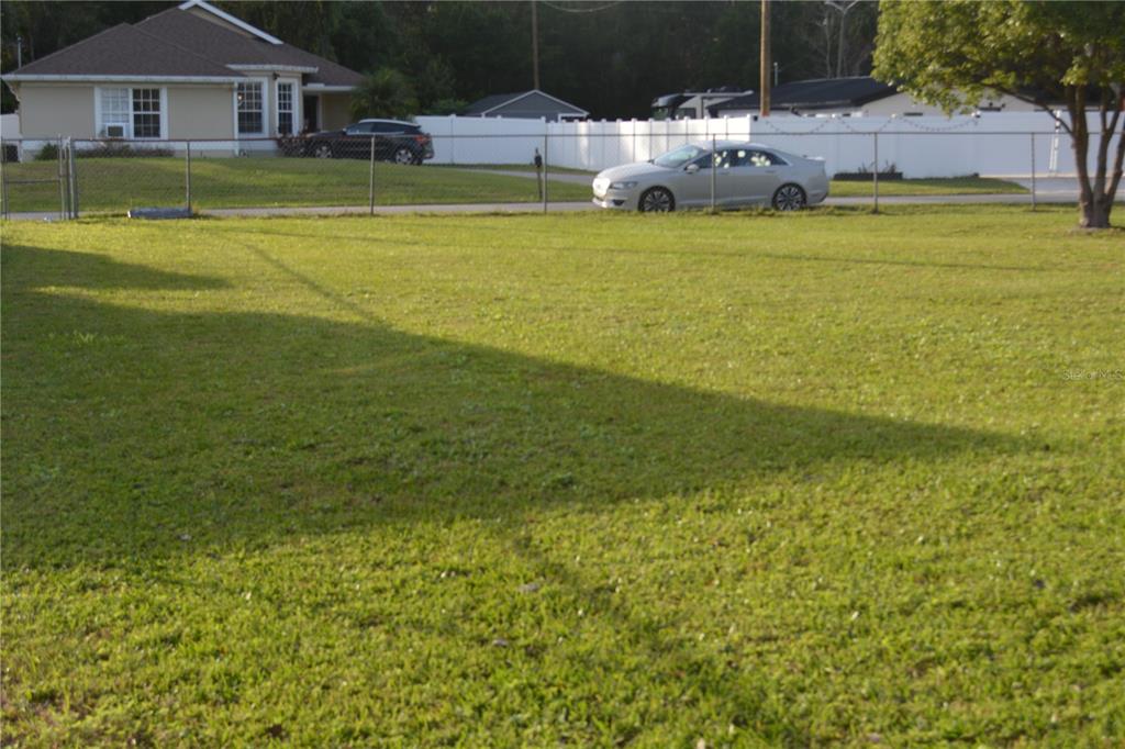 a view of a house with a big yard