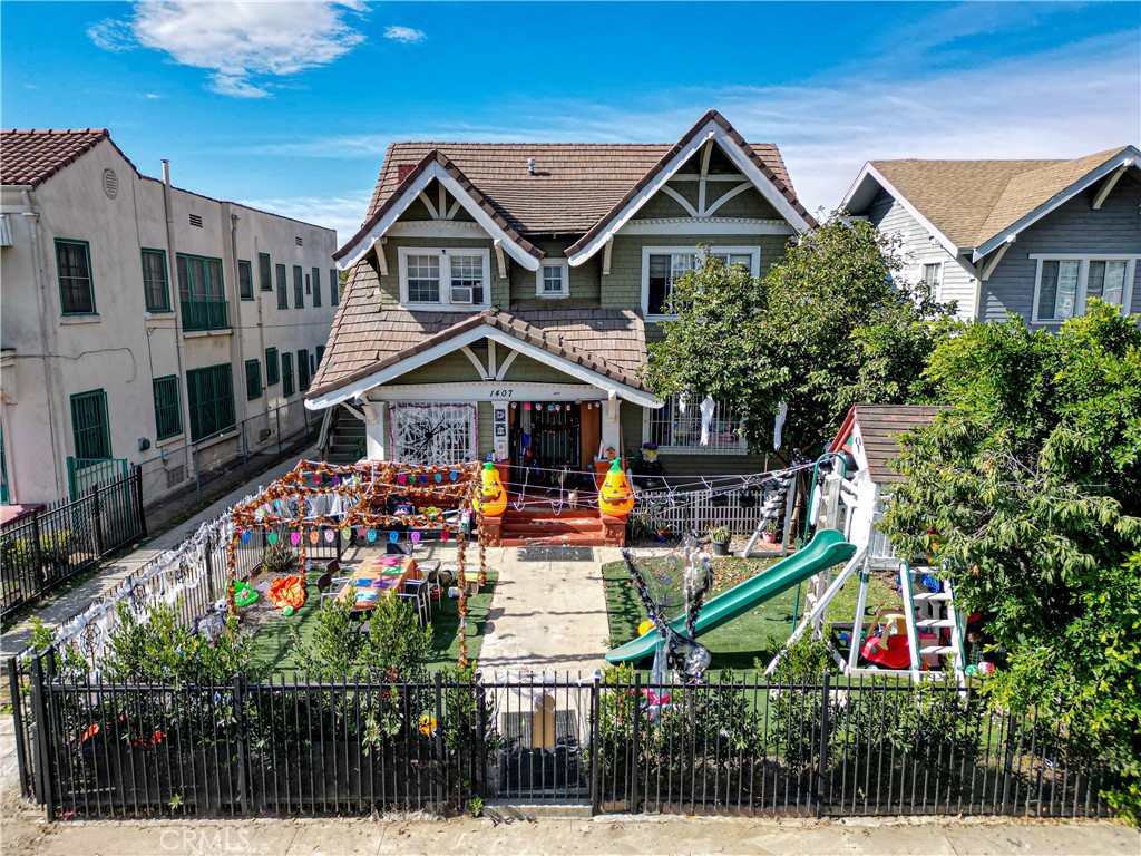 a front view of houses with yard