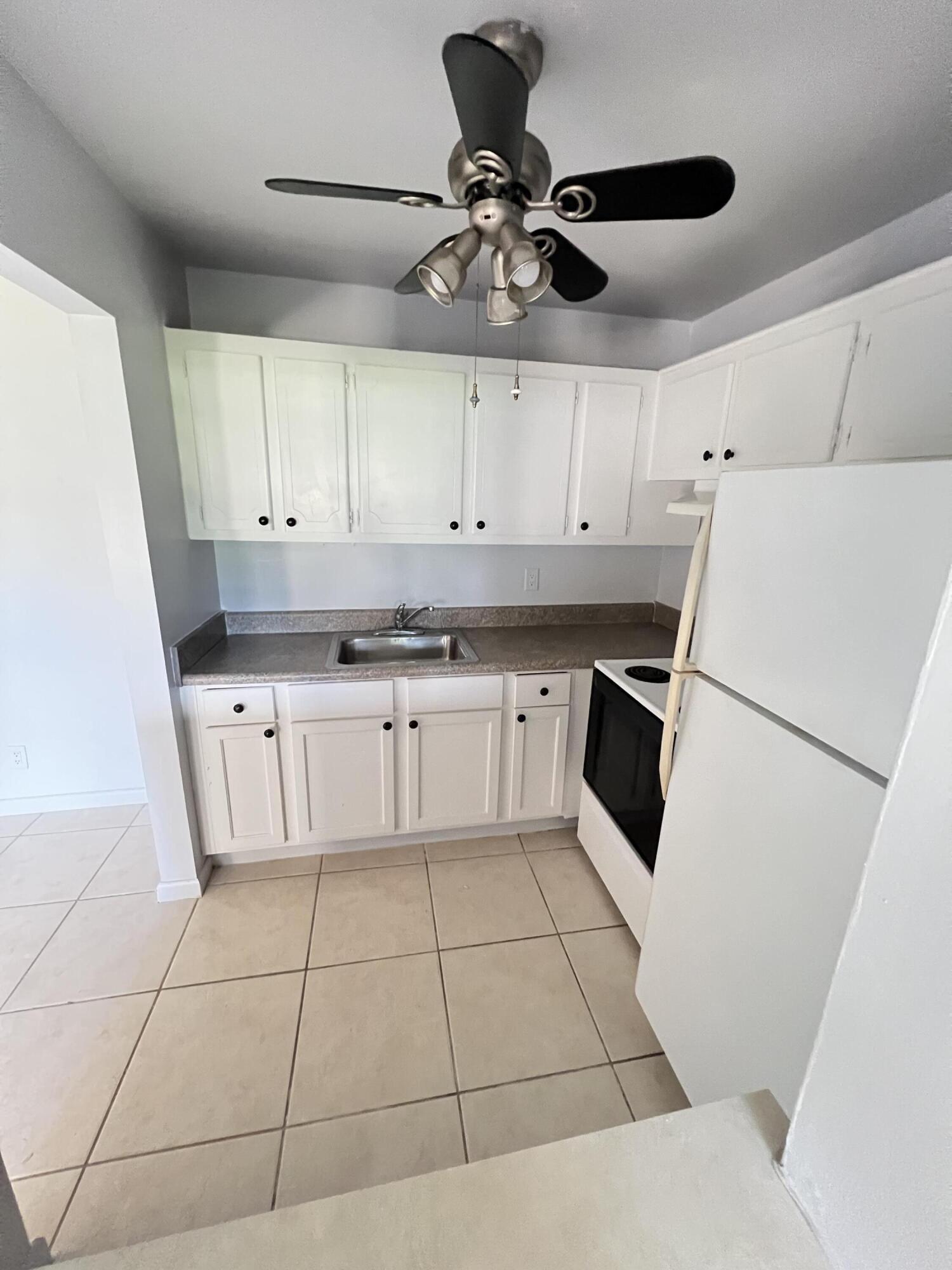 a kitchen with cabinets and appliances