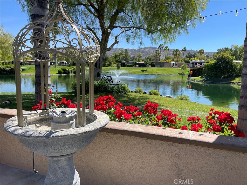 a view of a house with a swimming pool and a yard