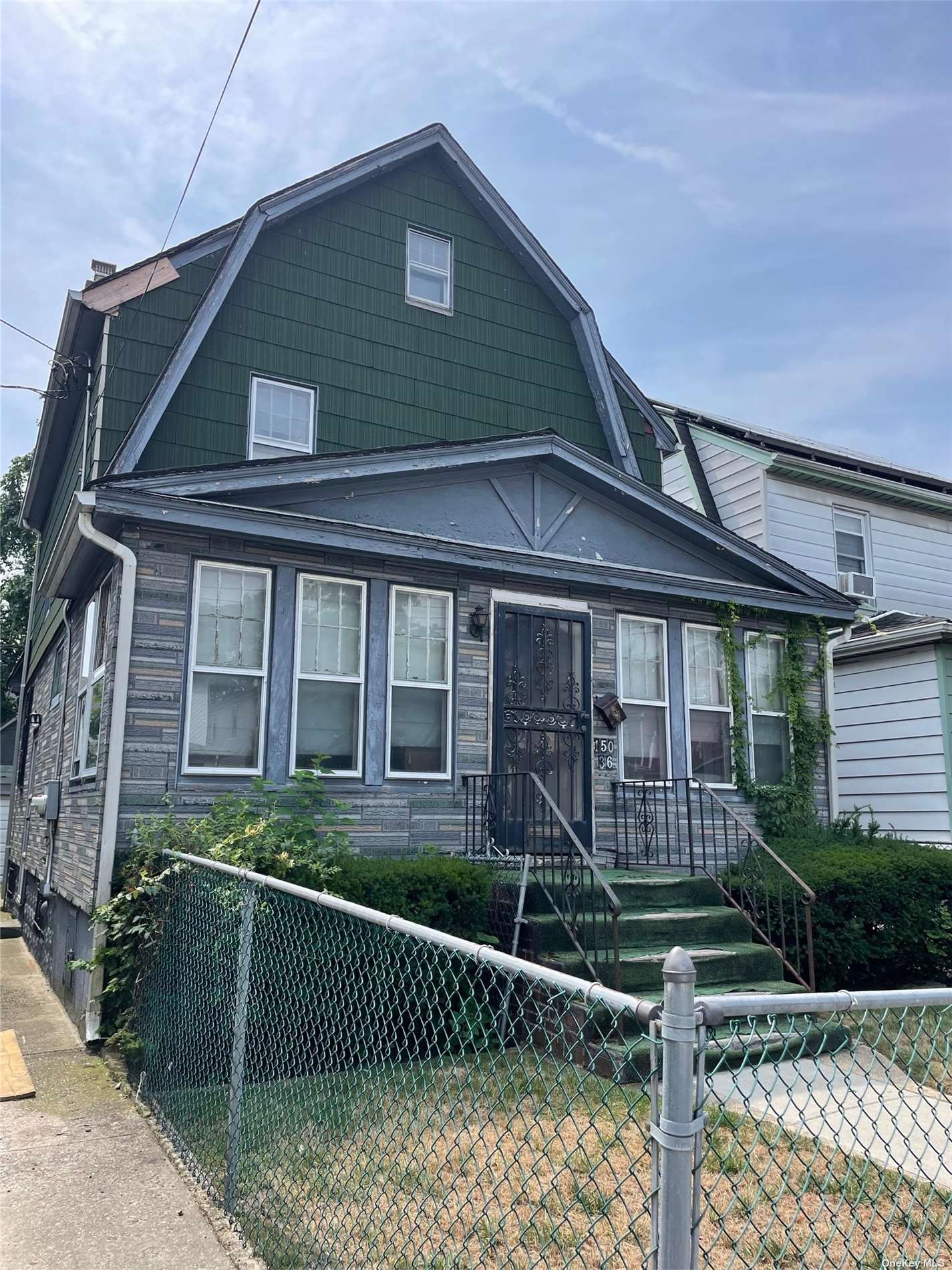 a front view of a house with a porch