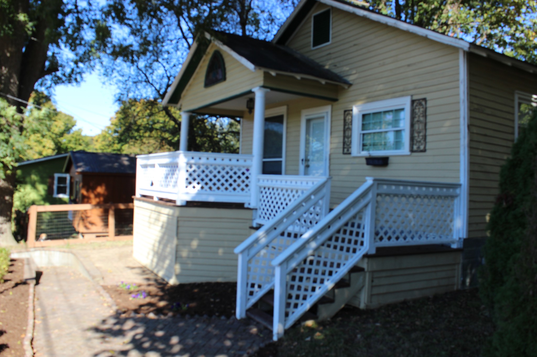 a view of house with roof deck and seating space