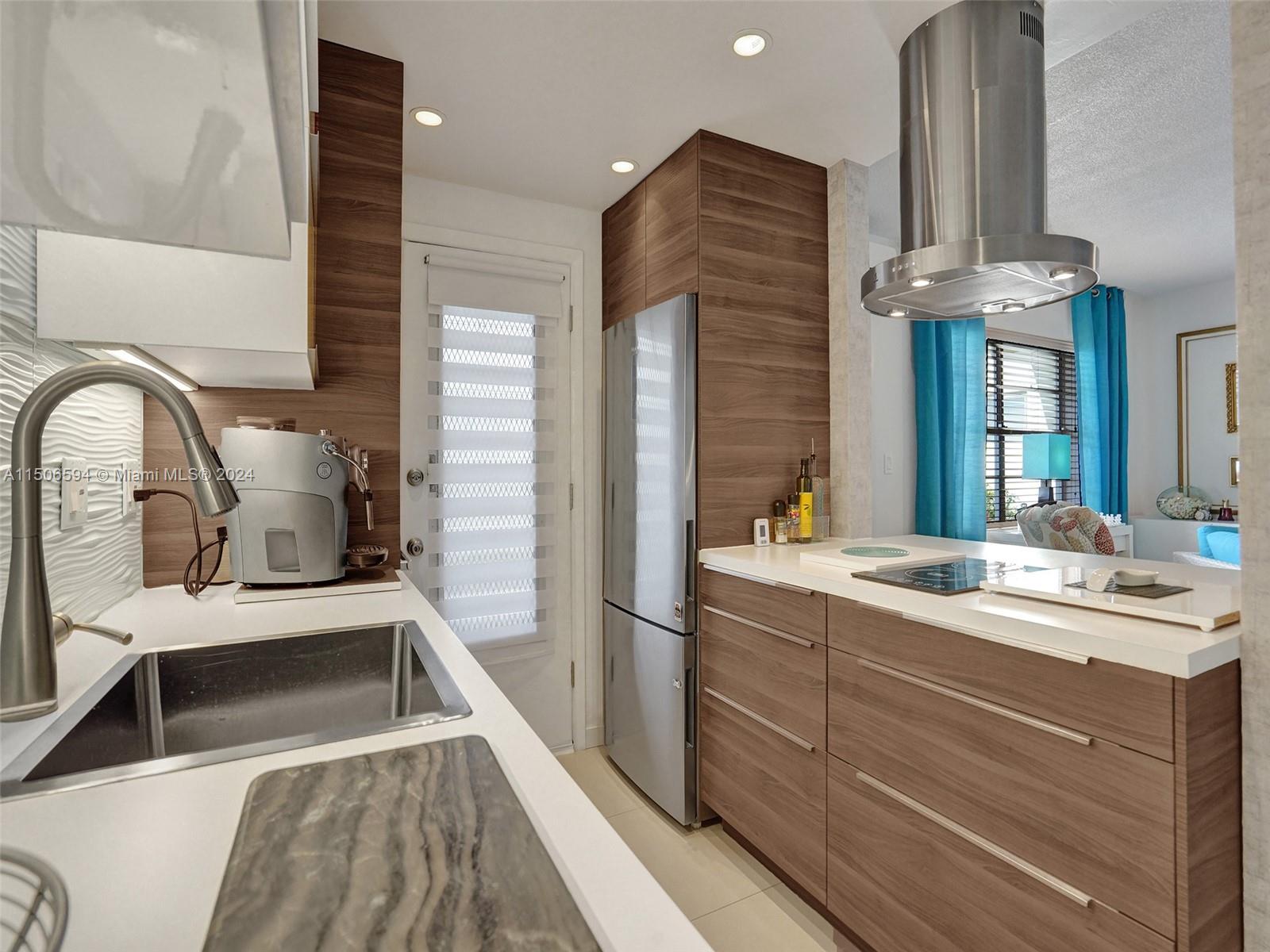 a kitchen with a sink and a refrigerator