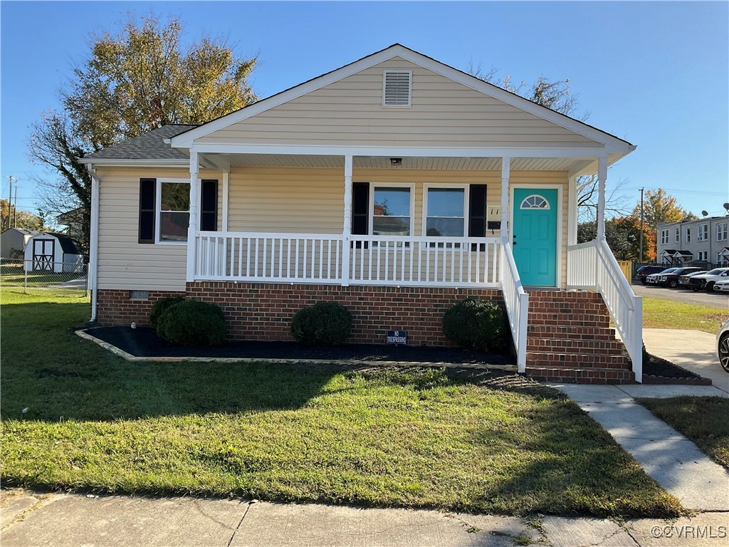 View of front of home featuring covered porch and