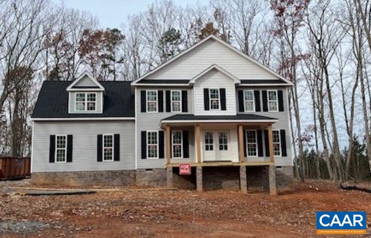 a front view of a house with garage