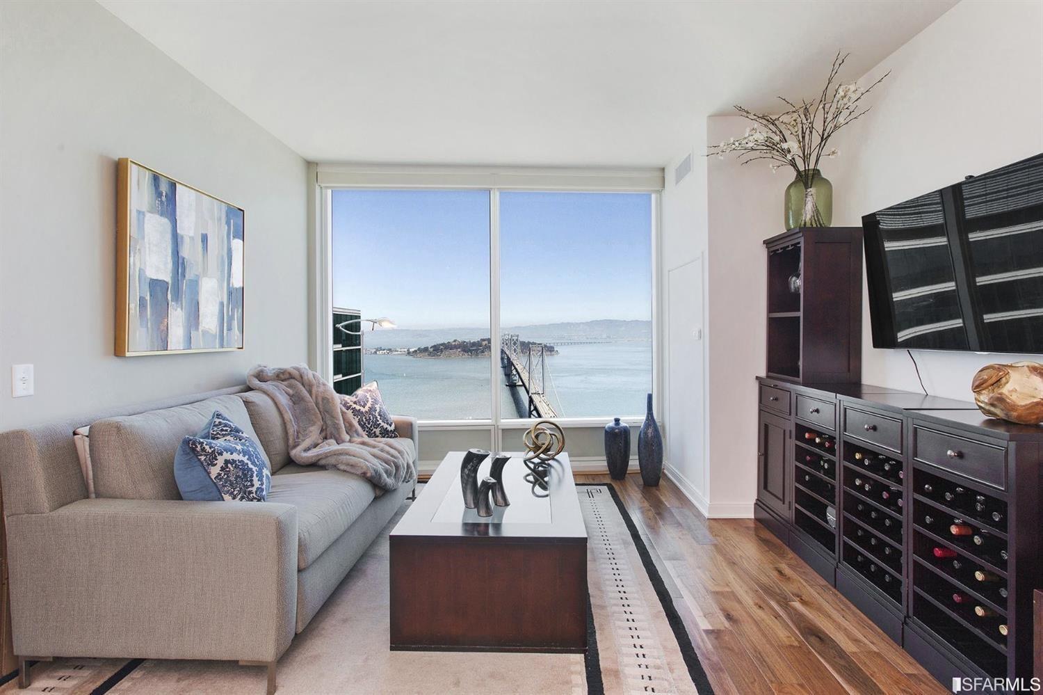 a living room with furniture fireplace and flat screen tv