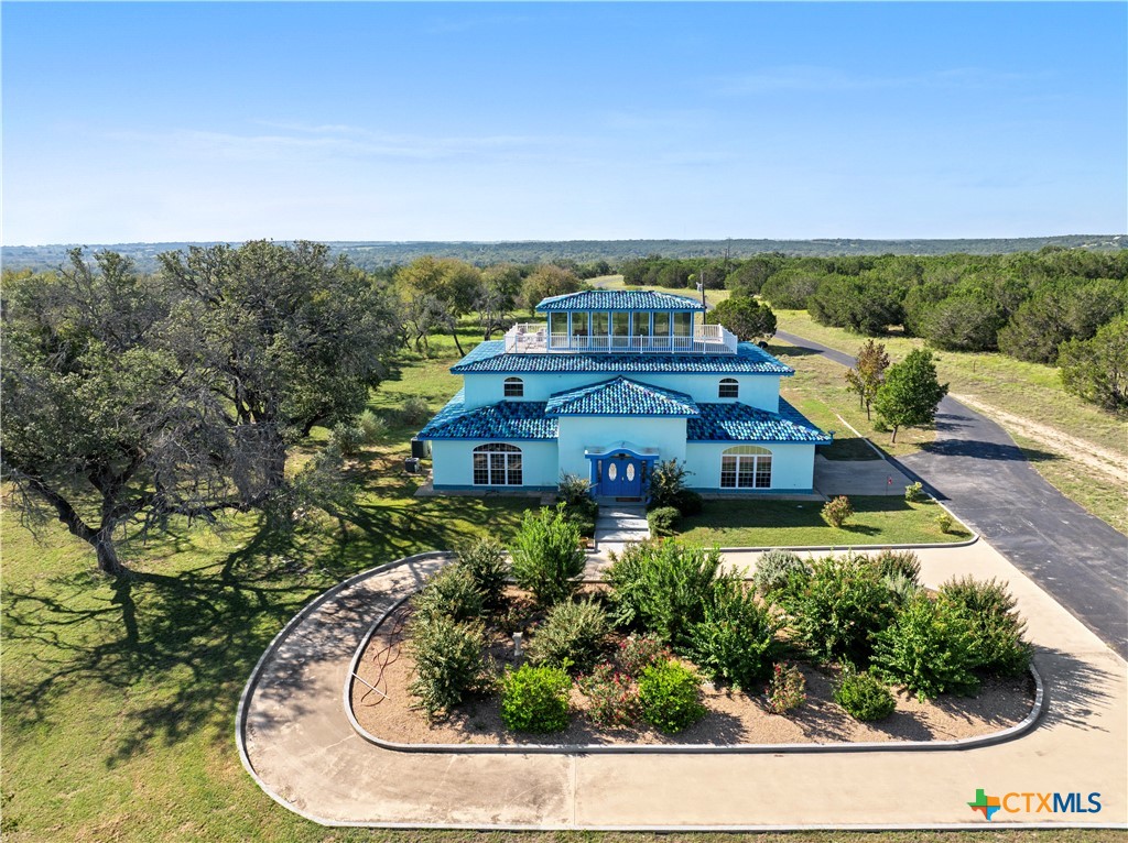 an aerial view of a house with a garden