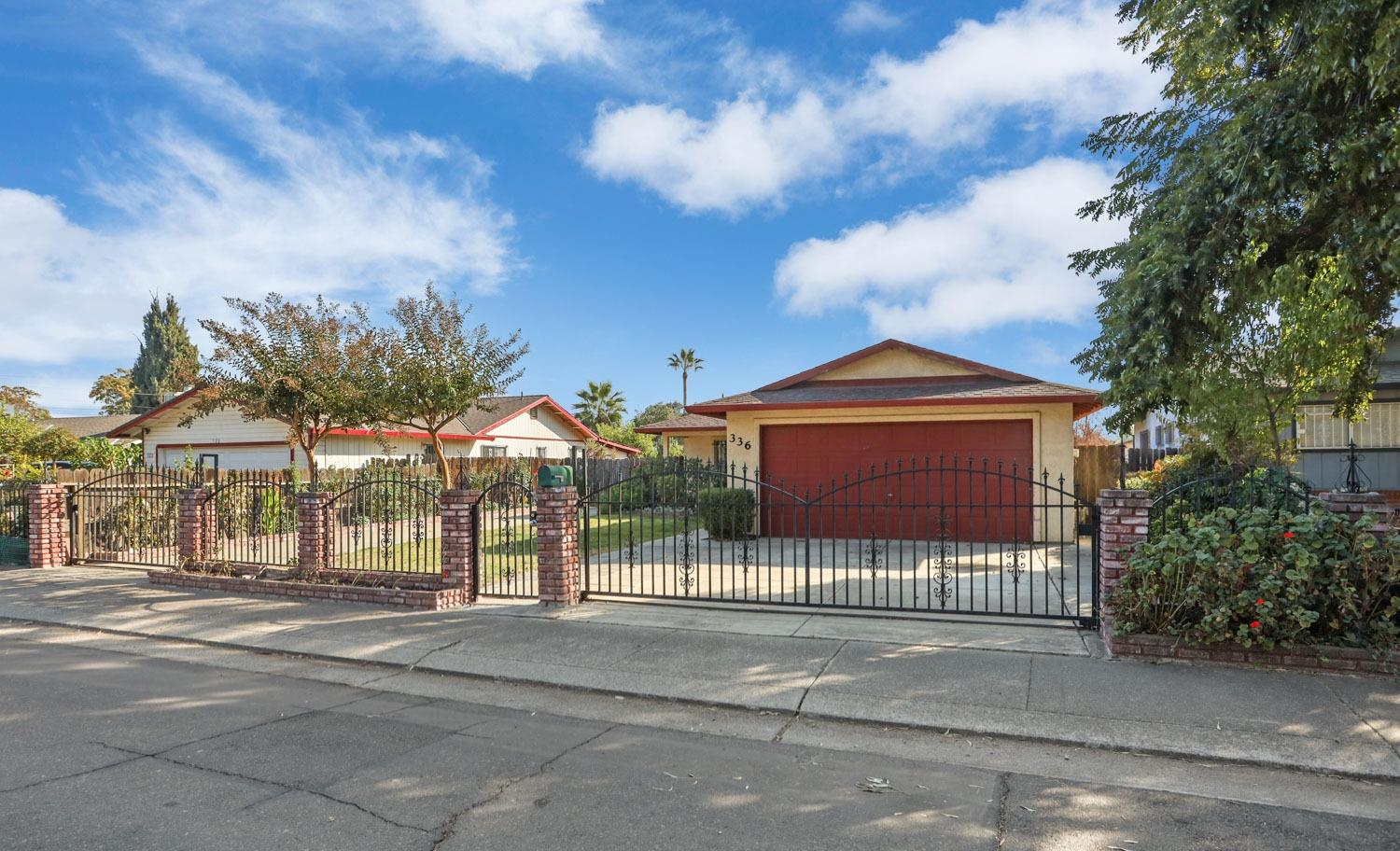 a view of a house with a iron fence