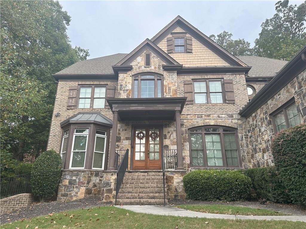 a front view of a house with a yard