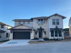 a front view of a house with a garage