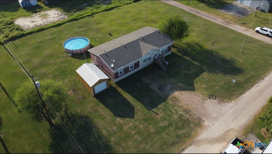 a aerial view of a house with a yard