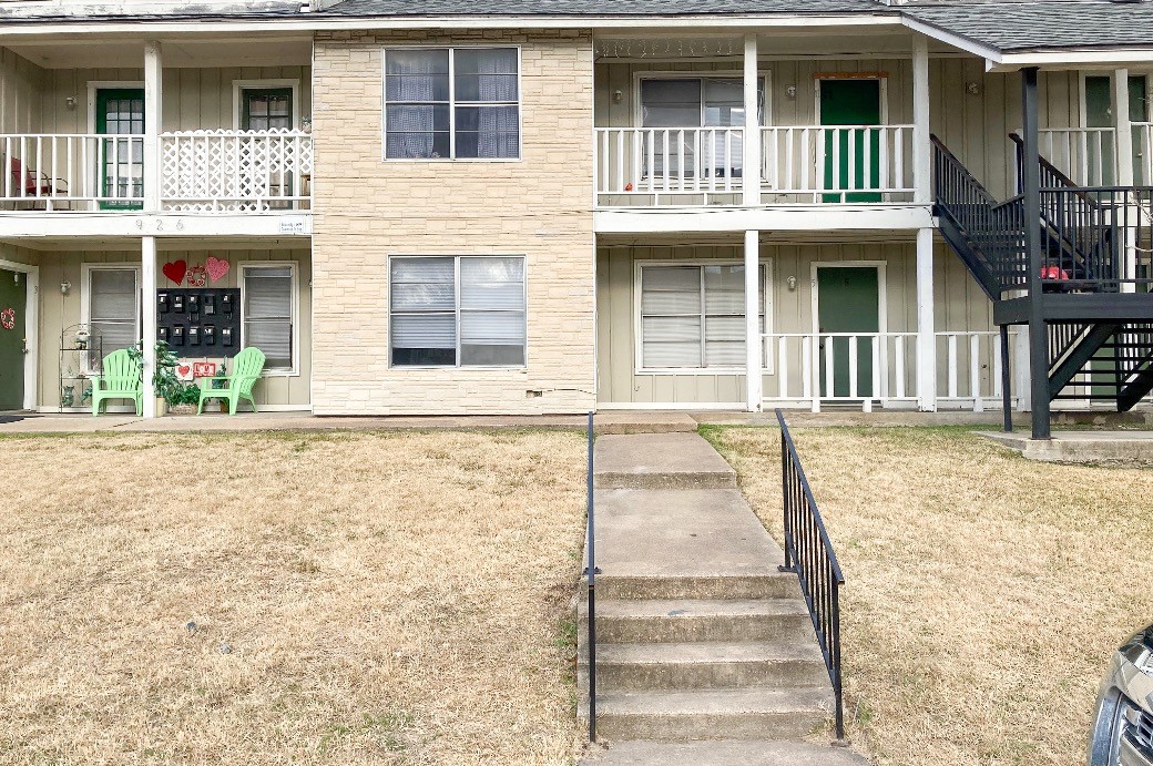 a front view of a house with a porch