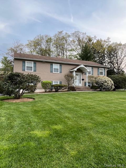 View of front of house featuring maintenance free vinyl siding