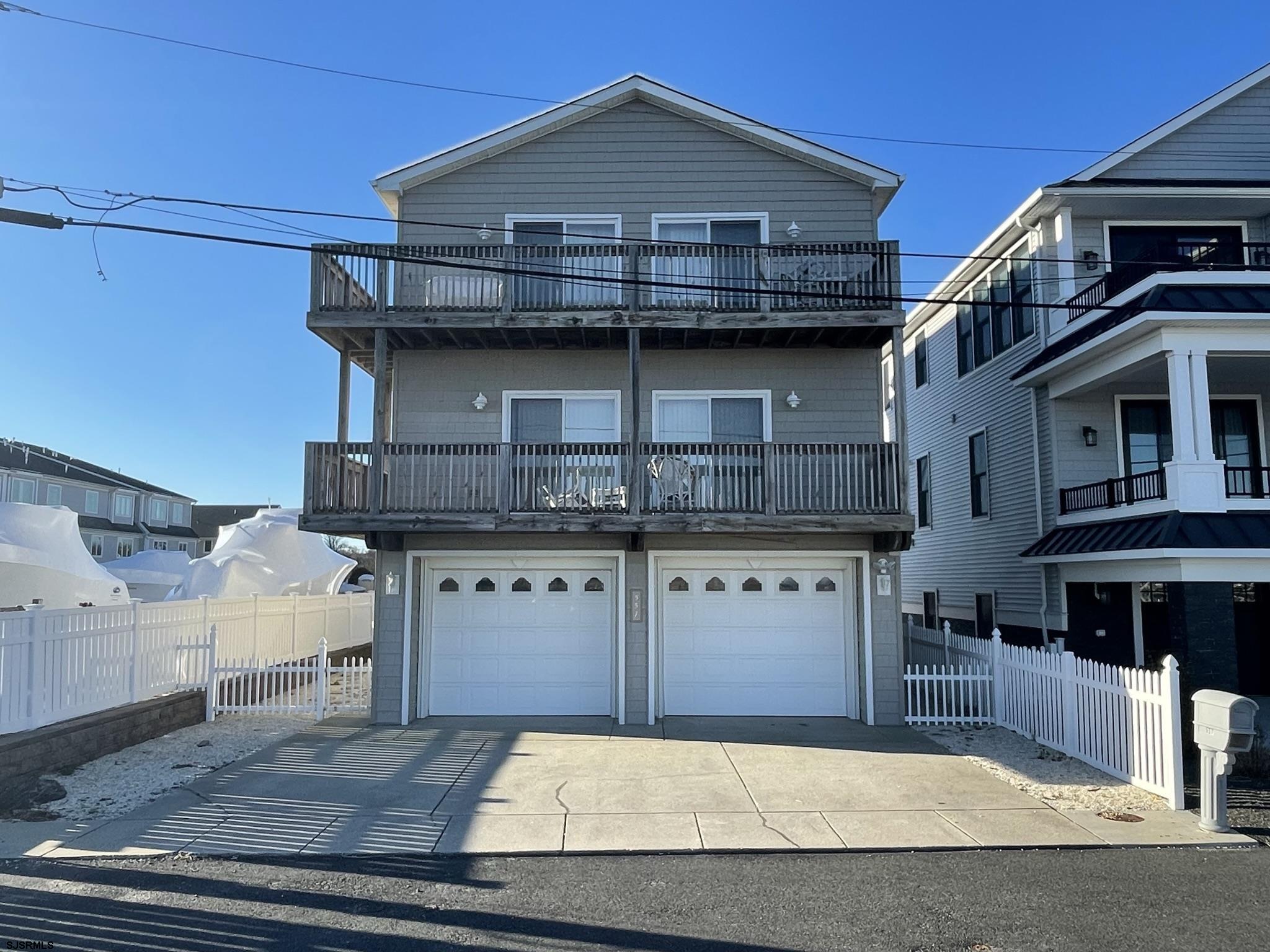 a front view of a house with garage