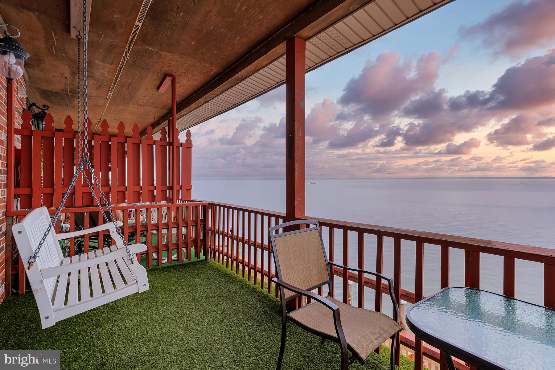 a view of a chair and table in the patio