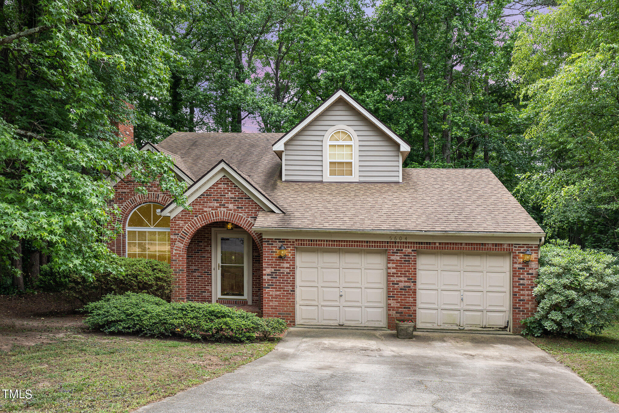 a front view of a house with a garage