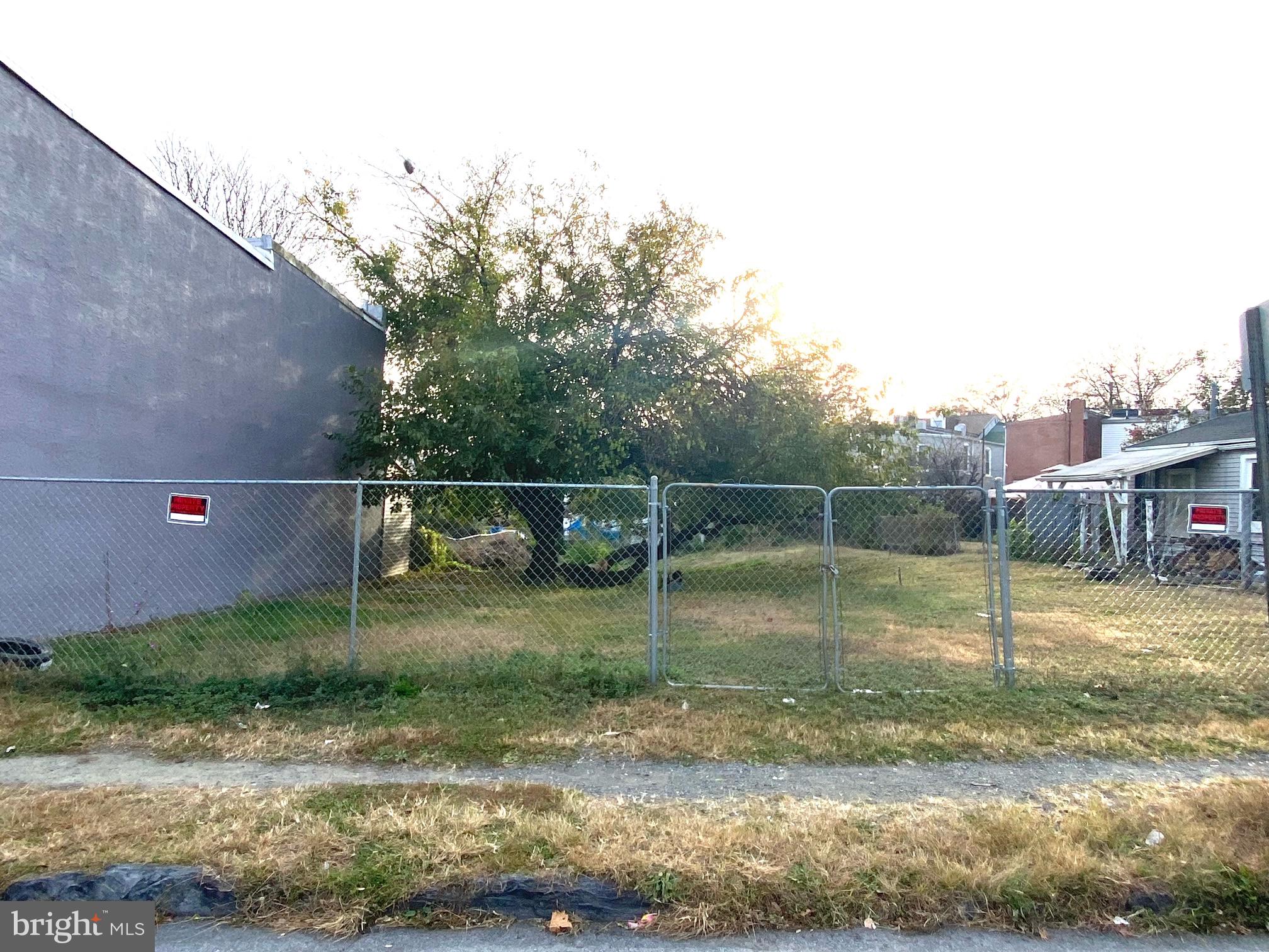 a backyard of apartments with large trees