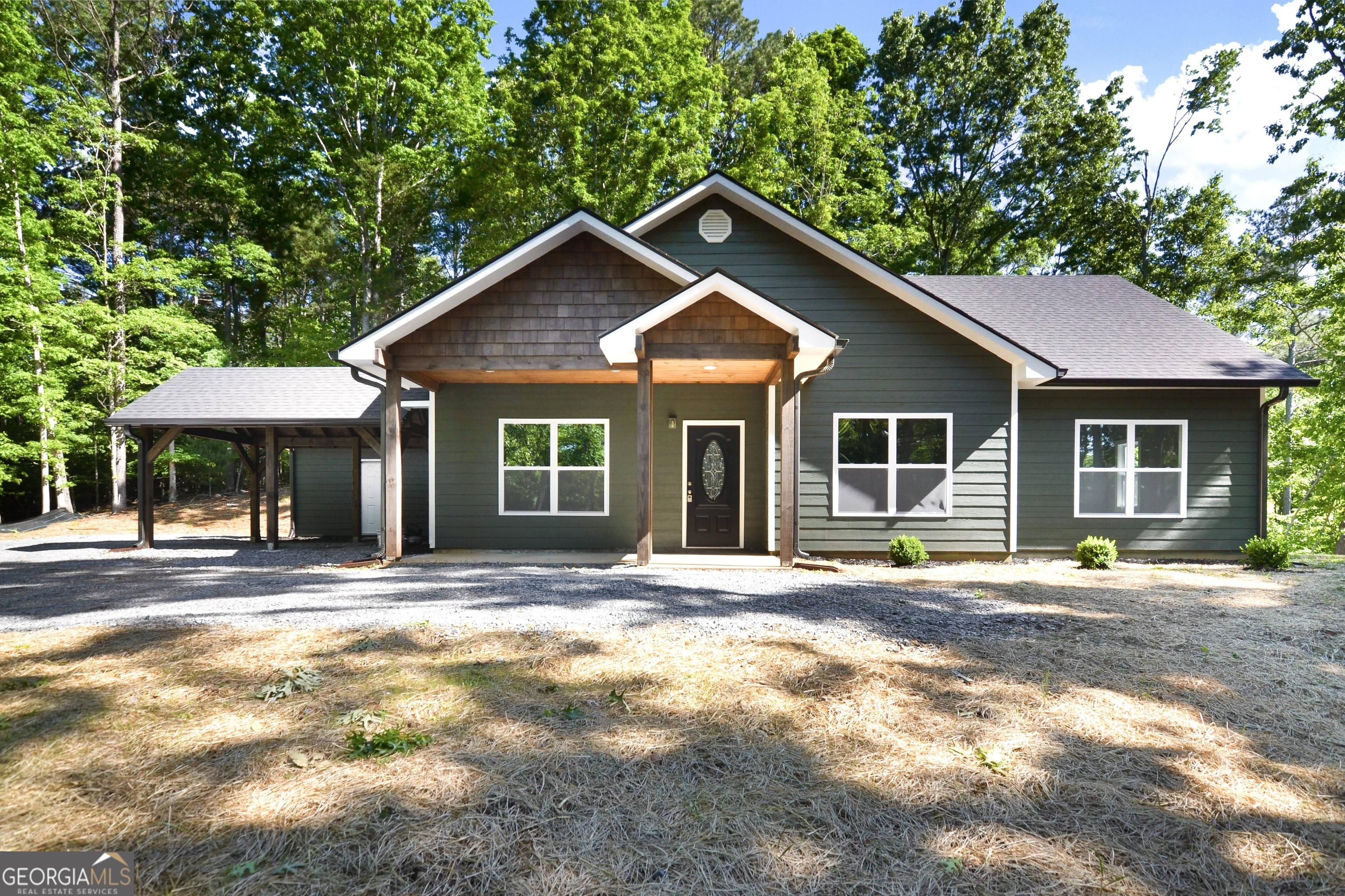 a front view of a house with a yard