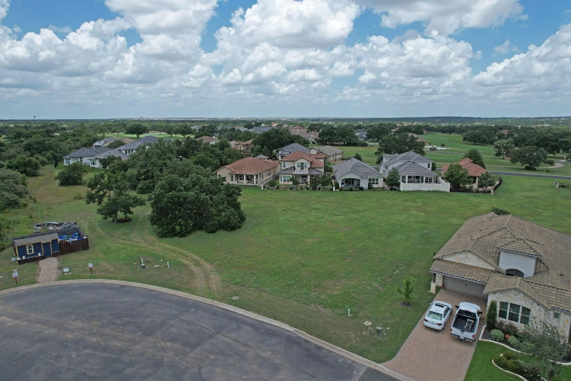 an aerial view of a house with outdoor space