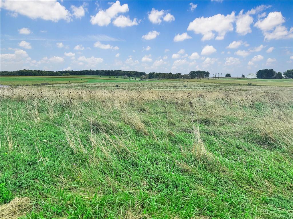 a view of a golf course with a big yard