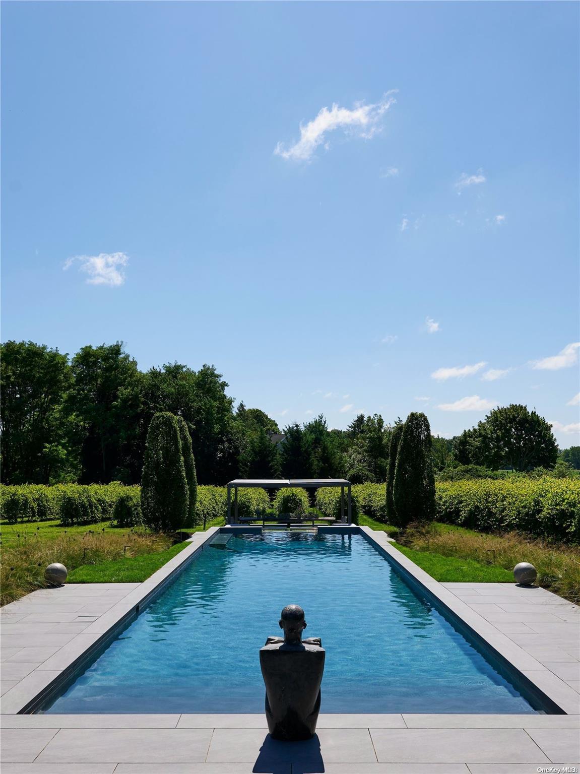 a view of a swimming pool with a table and chairs