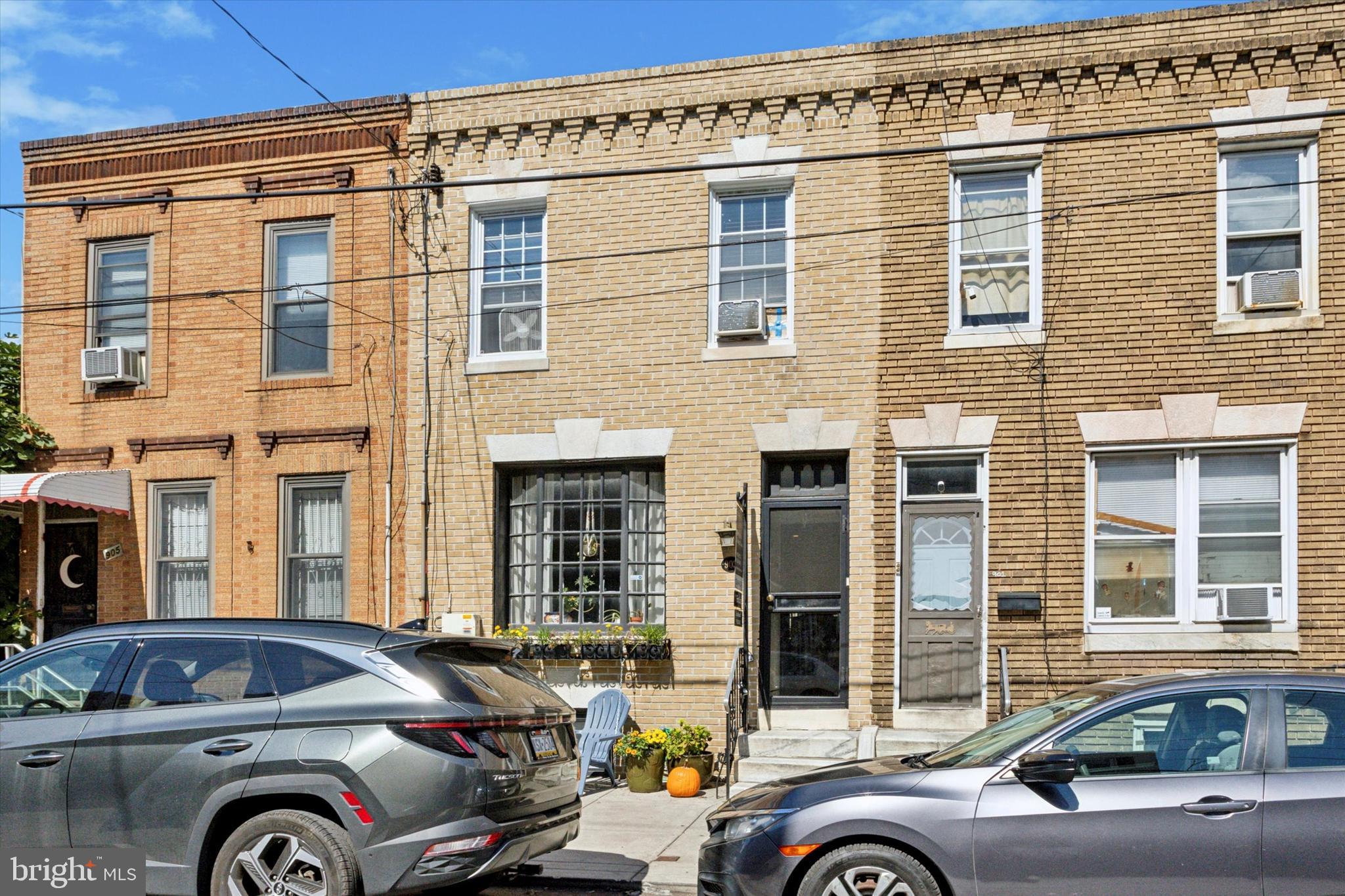 a front view of a house with parking space