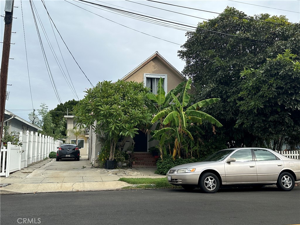 a view of a car parked in front of a house