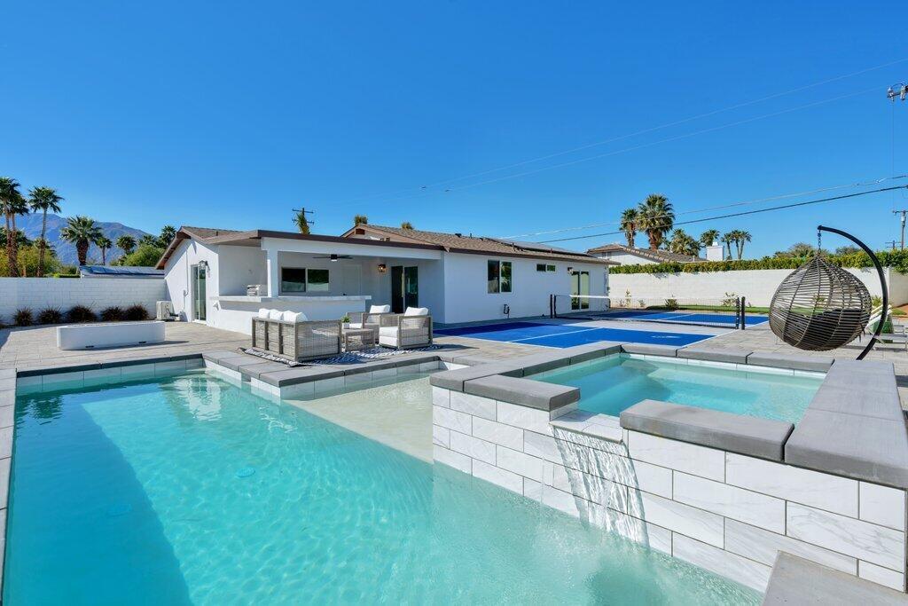 a view of a house with swimming pool