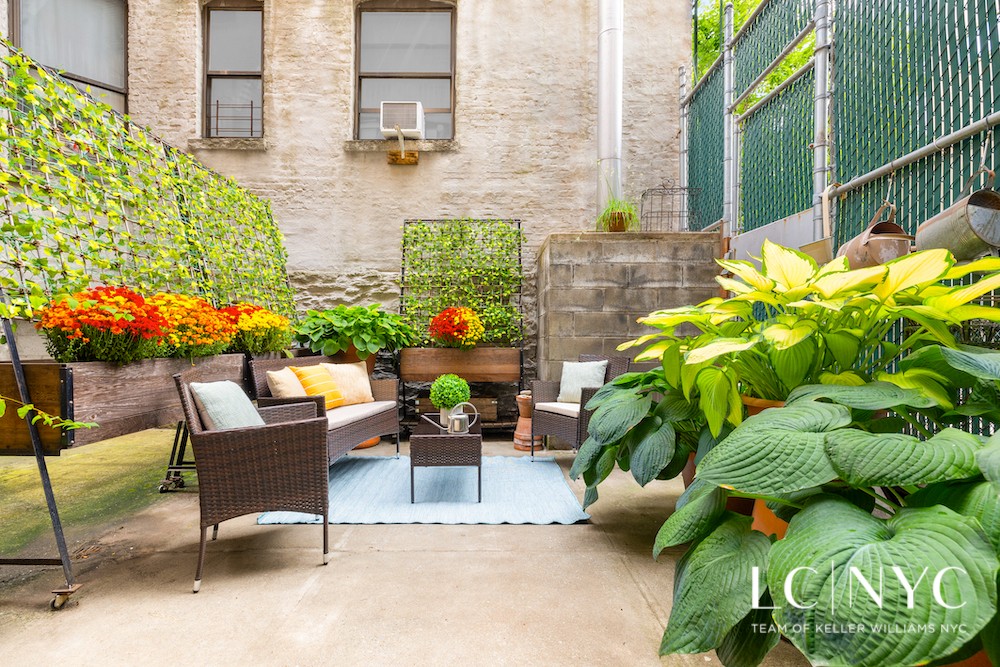 a view of a chairs and table in a patio