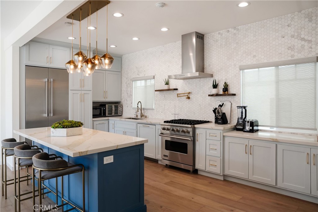 a kitchen with a stove a sink and a stove