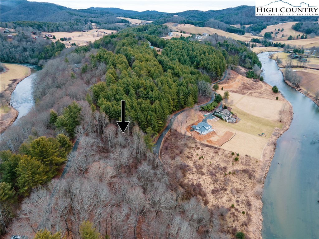 an aerial view of a house with mountain view