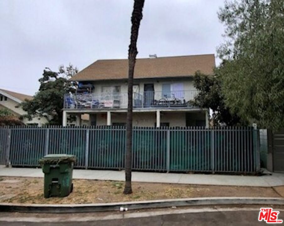 a view of a house and a yard