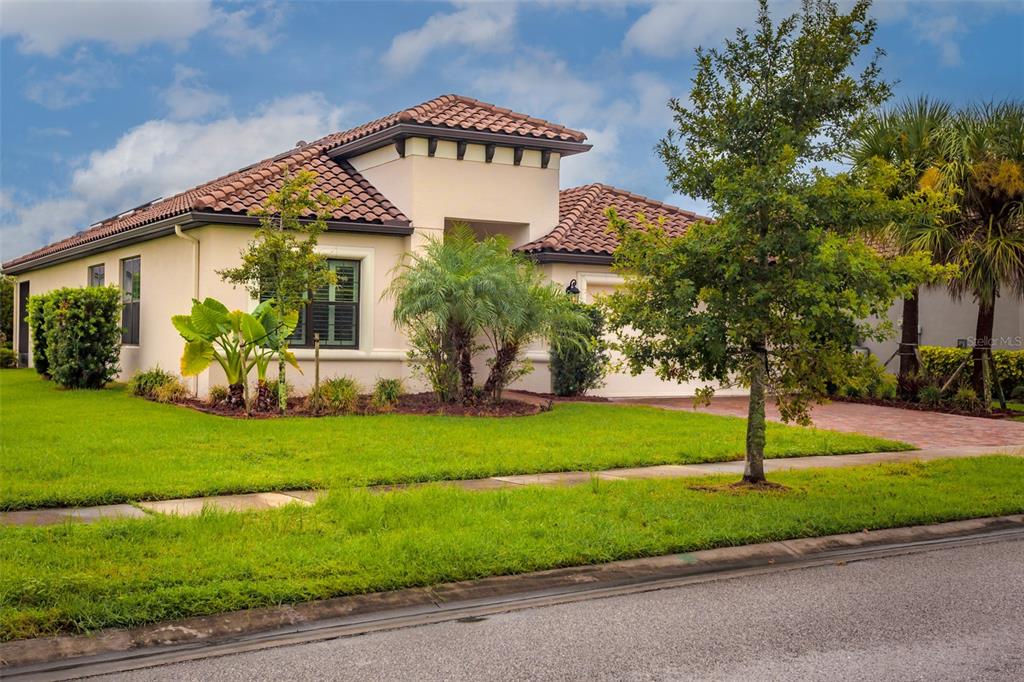 a front view of a house with a yard