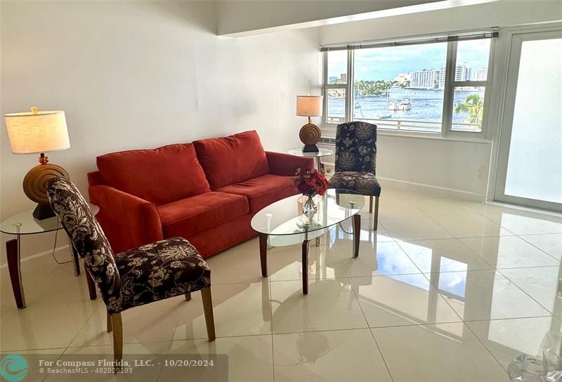 a living room with furniture and a window