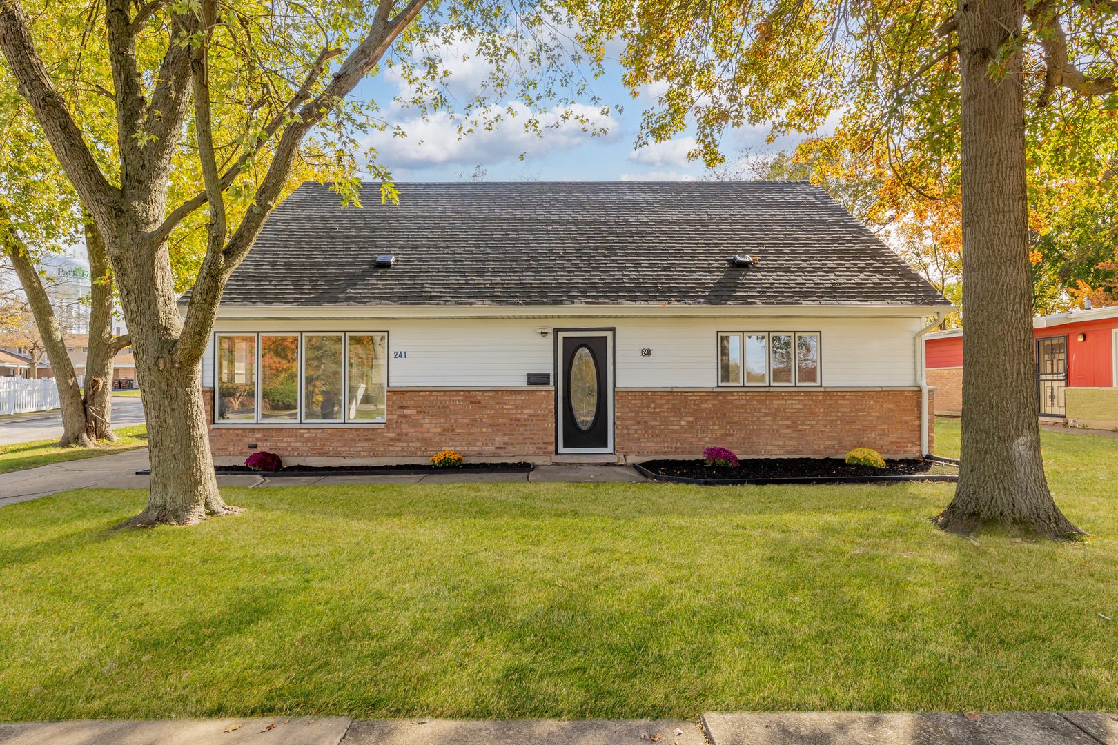 front view of a house with a yard