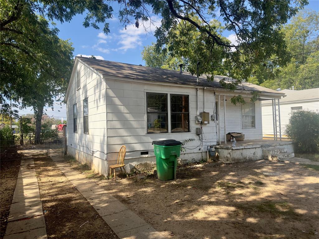 a front view of a house with sitting area