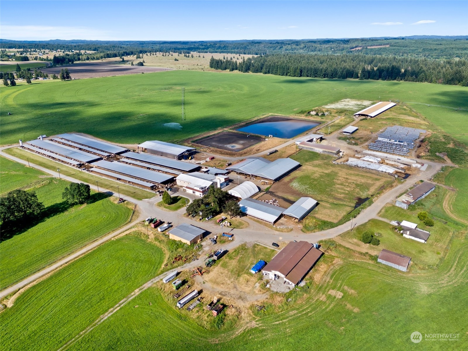 an aerial view of a residential houses with outdoor space and garden