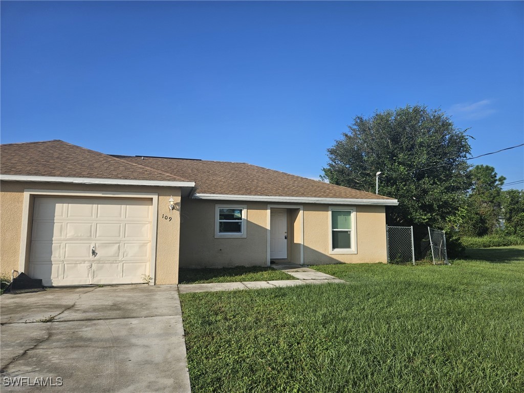 front view of a house and a yard