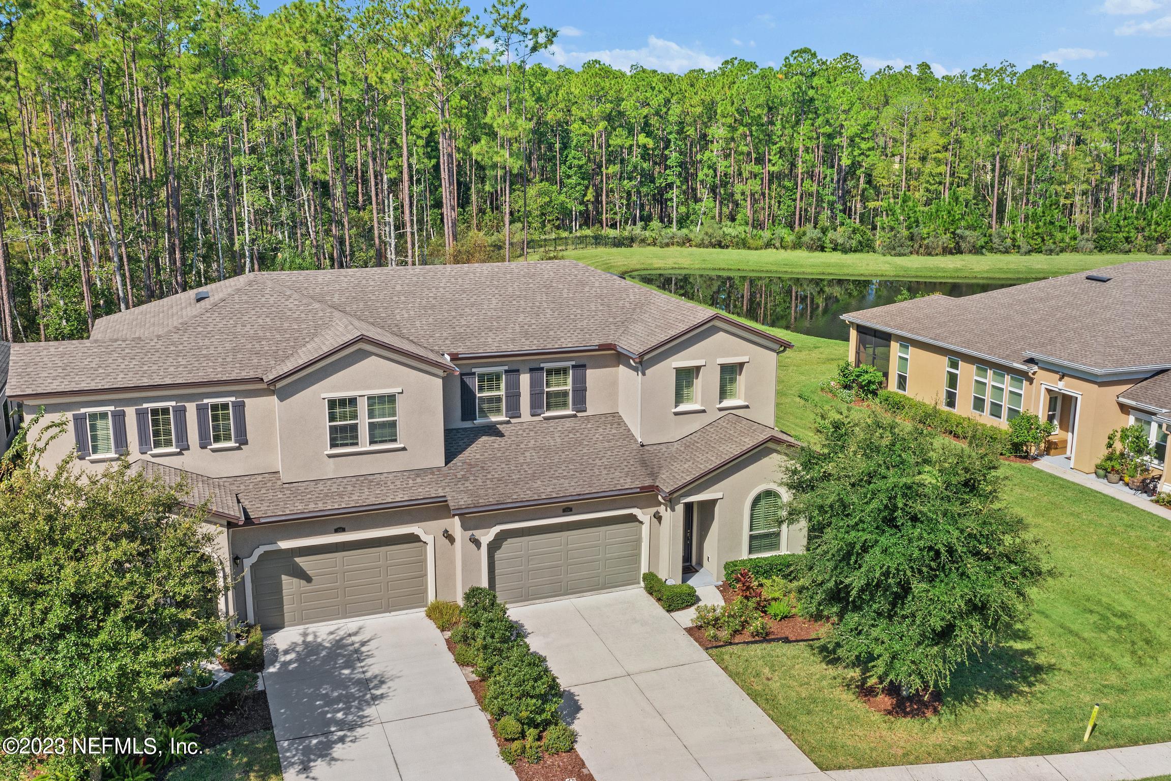 a aerial view of a house with a yard