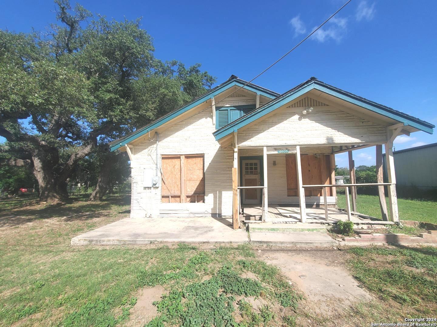 a house with yard in front of it